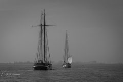 Two boats sail out to sail